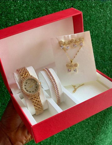 A RED BOXED WATCH AND BRACELET